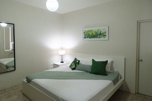 Drift off to sleep surrounded by tasteful decor and a comfortable bed. This room offers a harmonious blend of style and coziness for your stay.