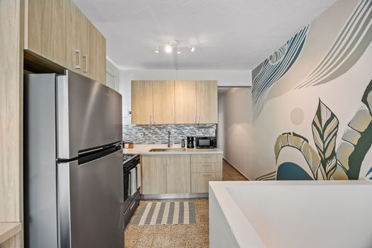 Seamlessly connecting the living area to the well-equipped kitchen.