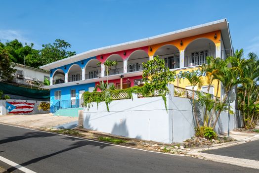 Vibrant guest house with a captivating, colorful facade.