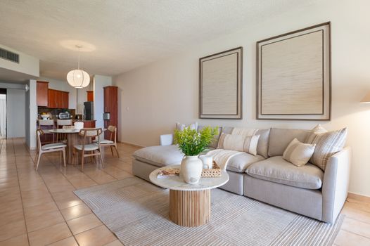 Chic coastal living meets modern comfort. Enjoy seamless flow between the inviting living room and elegant dining area.
