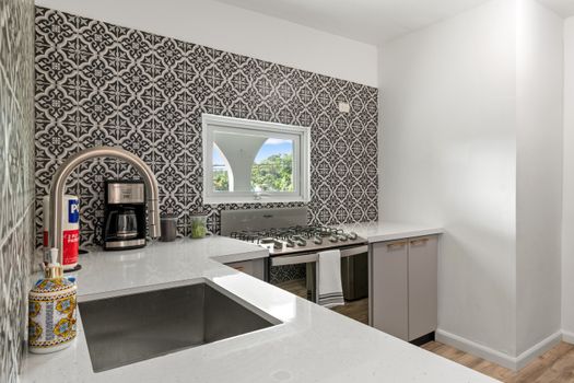 Fully equipped kitchen featuring modern appliances for your convenience.