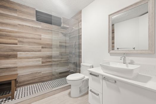 Stylish shower with chic wood-look tiles and modern fixtures
