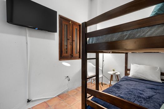 Our modern bunk bed room is the perfect base for solo travelers or friends exploring the city. With a full-size bed below and a twin above, you’ll have plenty of space to rest and recharge. This room is not just a place to sleep—it’s a space where comfort meets convenience.