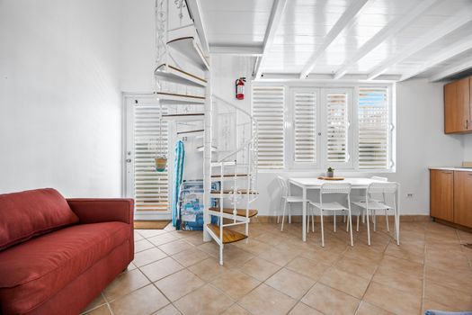 Enjoy meals in a bright dining area with open layout to a fully-equipped kitchen – perfect for group stays.