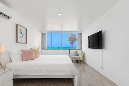 Spacious bedroom with a minimalist design.