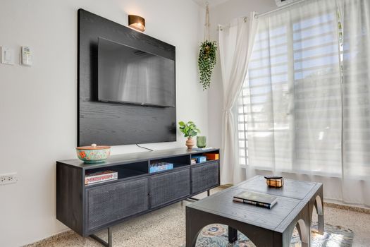 Relax in style in this inviting living room, perfect for unwinding.