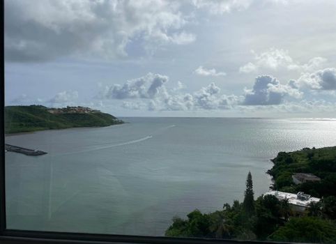 Postcard Perfect: Capture stunning moments with this beautiful view of the open water and elegant sailboats.