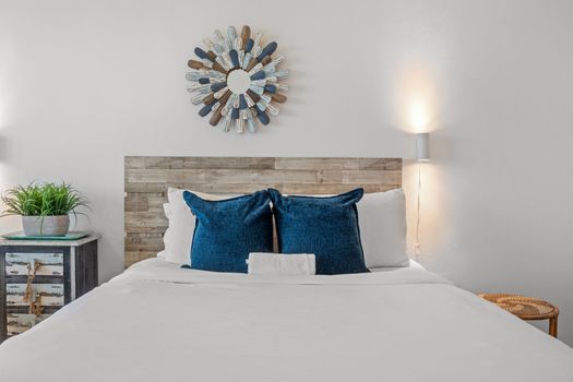 Your ultimate beachfront retreat awaits! This room provides ample space for up to four guests, a dedicated area for meals or work, and captivating views of the azure ocean.