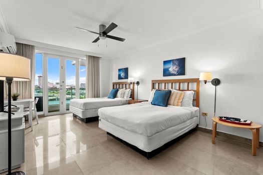 Spacious studio blending sleeping, living, and dining areas with captivating water views.
