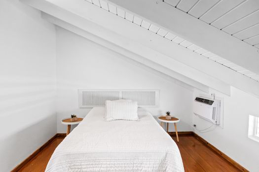 Unwind in a spotless white bedroom complete with comfy bed and cool air-conditioning for ultimate comfort.
