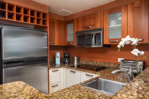 Convenience at your fingertips! This well-appointed kitchenette features a fridge, stove, microwave, and more.