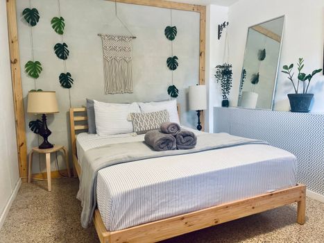 Bedroom: Queen Size Bed, clothing chest, Iron, Smart TV, Wifi, and Air Conditioning.