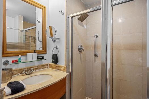 Refresh and rejuvenate. Our sparkling clean bathroom features a spacious walk-in shower with a rain showerhead, perfect for washing off the day's adventures.