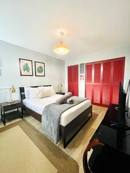 Unwind in comfort! Our spacious bedroom features a plush Queen-sized bed with crisp linens, promising a restful night's sleep after a day of adventure.