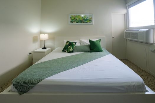 This room combines essential amenities with a comfortable sleeping area, ensuring a practical and enjoyable stay with everything you need within reach.