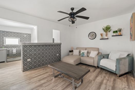 Chic tiled breakfast bar connects the living space to the kitchen.