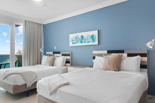 Rest easy in your cozy haven. Comfortable queen bed & thoughtful design ensure a peaceful night's sleep.