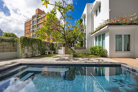 Enjoy a refreshing swim by the huge pool just steps from your door. sunbathe