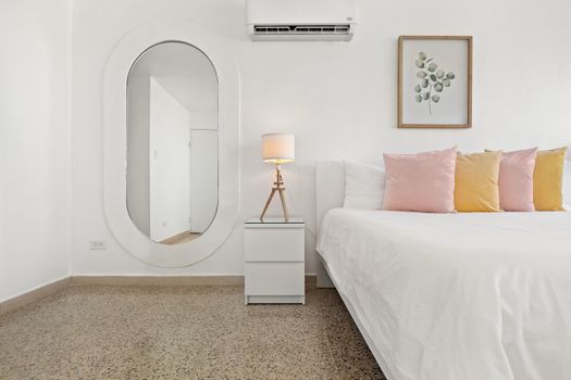 White walls and a light wood floor create a clean and open feel.