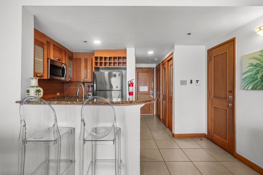 Entertain guests effortlessly with this open kitchen design, providing easy access to both the living area and dining spaces.