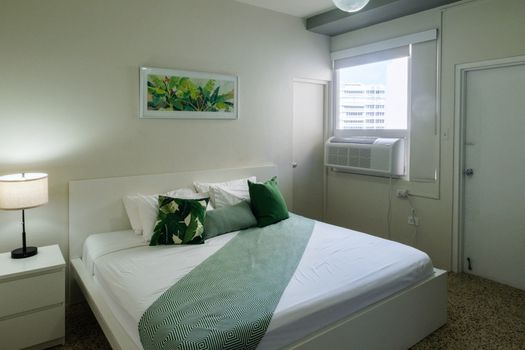 Settle into the pristine comfort of this elegant bedroom. With its fresh linens and thoughtful setup, it's the perfect sanctuary for deep, restorative sleep.