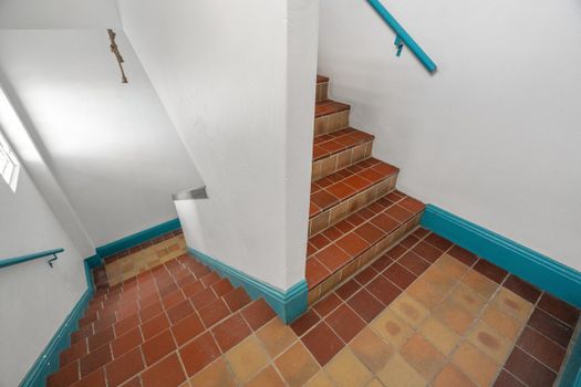Stairs leading to the 4th-floor apartment