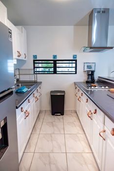 Prepare your favorite meals in our well-appointed kitchen! Featuring a full-sized refrigerator, stovetop, and ample counter space, it has everything you need for a comfortable stay.