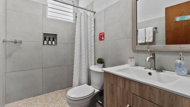 Invigorating showers: Well-maintained bathroom with a sleek design.