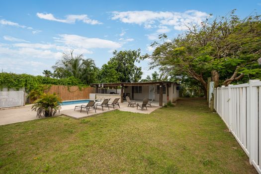 Enjoy the shade and fresh air by the pool.