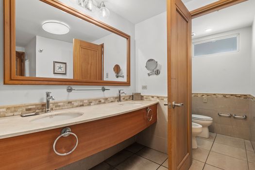 Enjoy the convenience of both a rejuvenating shower and a comforting bath in this well-appointed and pristine bathroom.