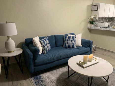 Cozy & Inviting Living Space: Sink into the comfortable sofa, perfect for unwinding after a day of exploring.