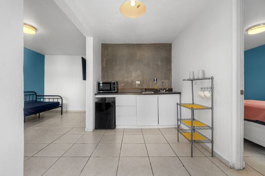 Immerse yourself in the graceful blend of simplicity and refinement showcased in this beautifully adorned kitchen space.