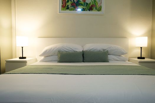 Discover a warm and welcoming atmosphere in this charming bedroom, perfect for unwinding and feeling right at home during your visit.