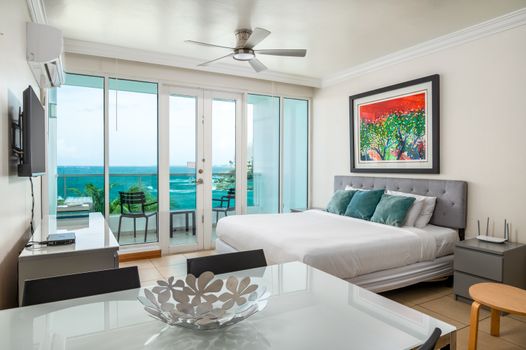 Bright and airy studio offering supreme comfort, a chic design, and an incredible beachfront panorama.