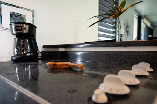 Enjoy the convenience of a modern kitchen setup with a coffee maker and a cooktop ready for your culinary adventures.