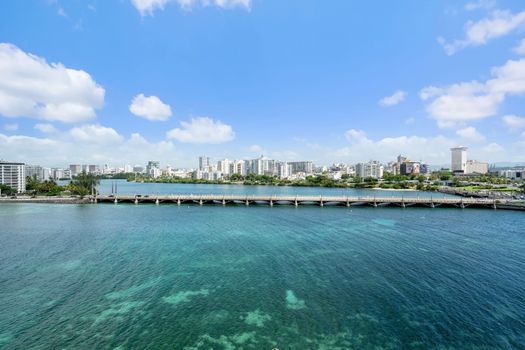 Behold the magnificent Condado Lagoon, a vibrant centerpiece of our locale. This panoramic view showcases the serene waters, lush surroundings, and the iconic bridge, inviting you to explore the beauty of San Juan from above.