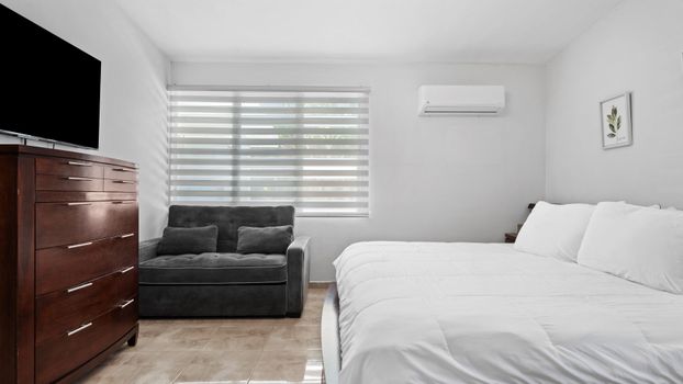 Unwind here: Tastefully decorated bedroom for ultimate relaxation.