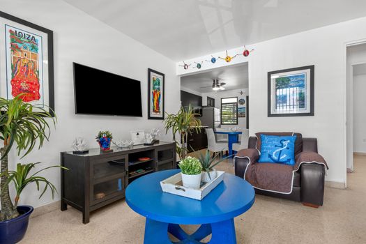Bright & Airy Retreat: Natural light floods this beautifully appointed living room, offering a tranquil escape after a day of adventures.