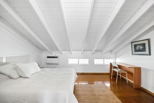 Stay productive with a dedicated work desk in this serene, air-conditioned bedroom retreat.