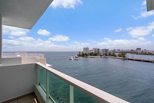 Your private sanctuary: step out onto the balcony and be mesmerized by the panoramic views of Condado Lagoon and the city skyline.