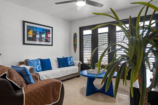 Relax in Style: Unwind in our cozy living area, designed for ultimate comfort and adorned with refreshing blue hues. Perfect for pre-dinner cocktails or a quiet evening in!