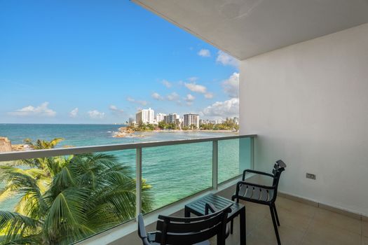 Your private balcony with sweeping ocean views & the vibrant San Juan skyline. Perfect for relaxing and soaking it all in.