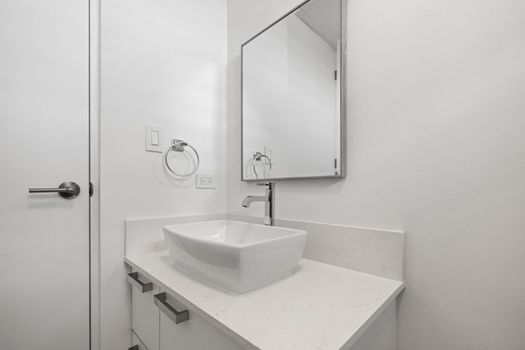 Modern bathroom with vessel sink & clean, contemporary design.