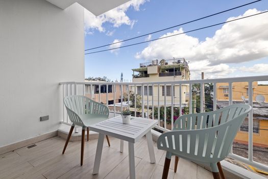 Enjoy your morning coffee with a breath of fresh air on this private balcony.
