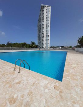 Dive into Paradise: Enjoy a refreshing swim in our sparkling pool, set against a backdrop of modern architecture and tropical skies.