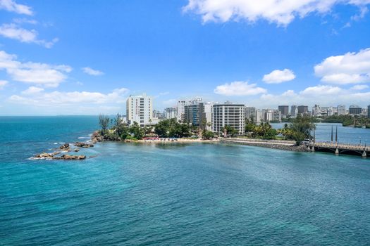 Your private window to paradise: a sweeping vista of the sparkling lagoon meeting the vast ocean and urban charm