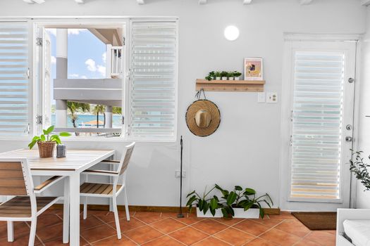 Breezy indoor dining with a view. Enjoy meals bathed in sunlight and surrounded by tropical charm