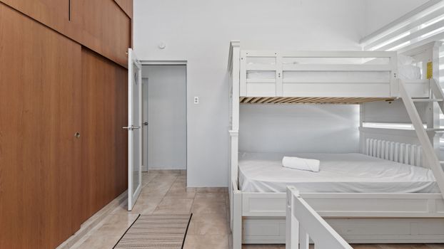 Versatile sleeping: Bunk bed with trundle, plus an extra bed.
