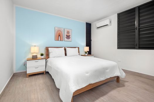 Slip into sweet dreams amidst the calming blue tones of your room.