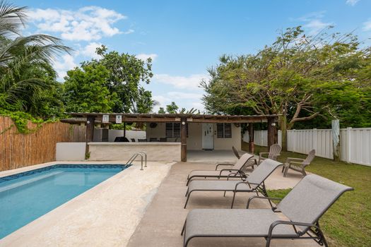Relaxing pool area with lounge chairs.